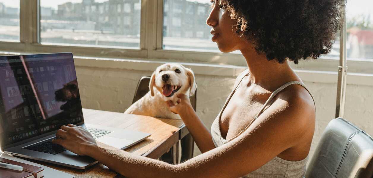 Women working from home with her dog