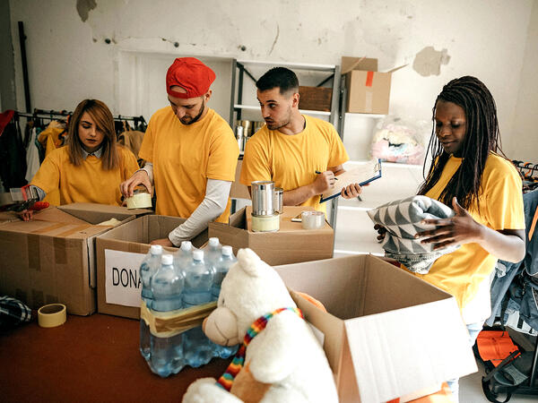 Volunteers putting donations in boxes