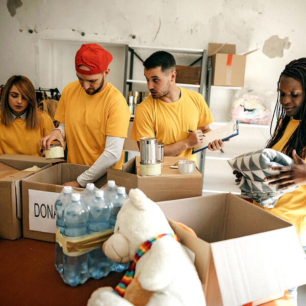 Volunteers putting donations in boxes